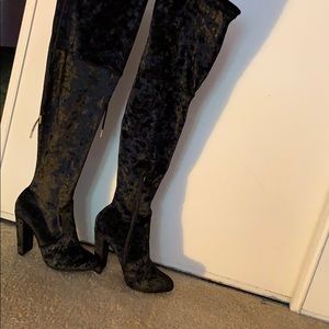 Black high thigh heeled boots